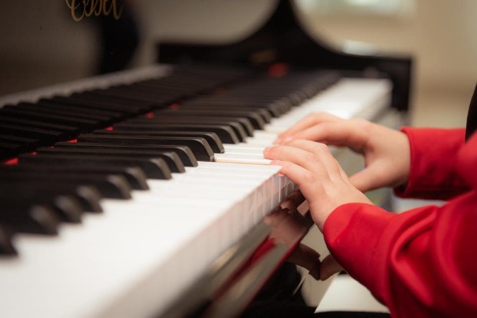 A person playing the piano with their hands